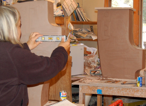 LEE CARVING CLAY SCULPTURE by dan and lee ross